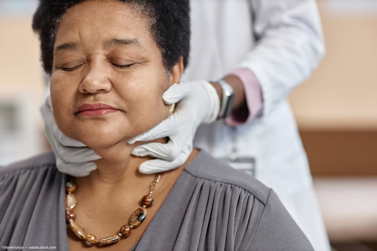 Physician palpating patient's neck Image Credit: AdobeStock/Seventyfour