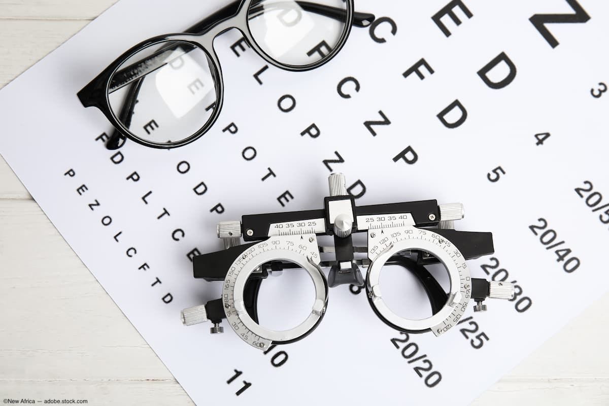 Trial frame, eye chart, and eyeglasses on table Image credit: ©New Africa - adobe.stock.com