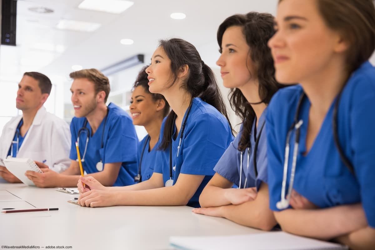 Group of medical students standing at table Image Credit: AdobeStock/WavebreakMediaMicro