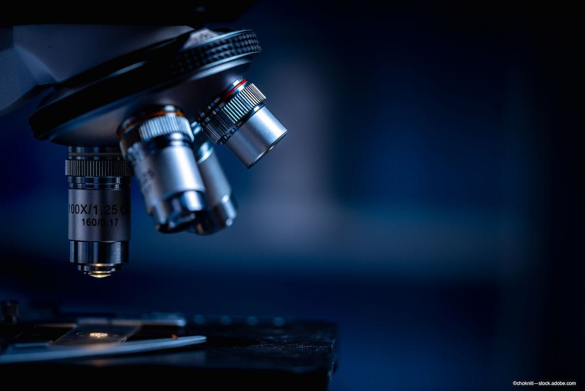 microscope looking at slide during cell therapy research - Image credit: Adobe Stock / chokniti