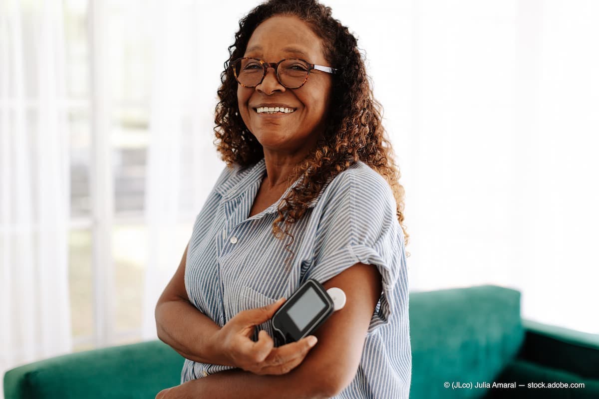 Senior woman using a flash glucose monitor to manage her diabetes at home (Adobe Stock / (JLco) Julia Amaral)