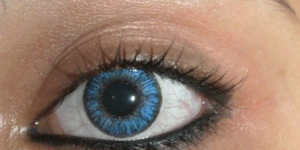 blue colored contact lens on eye