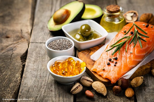 Selection of healthy unsaturated fats, omega 3 - fish, avocado, olives, nuts and seeds (Adobe Stock / anaumenko)