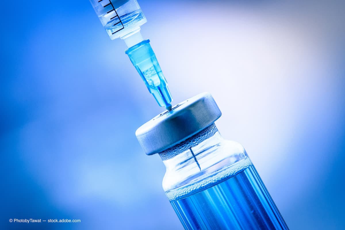 Close up of flu and measles vaccine vials with syringe injection, medicine and drug concept (Adobe Stock / PhotobyTawat)