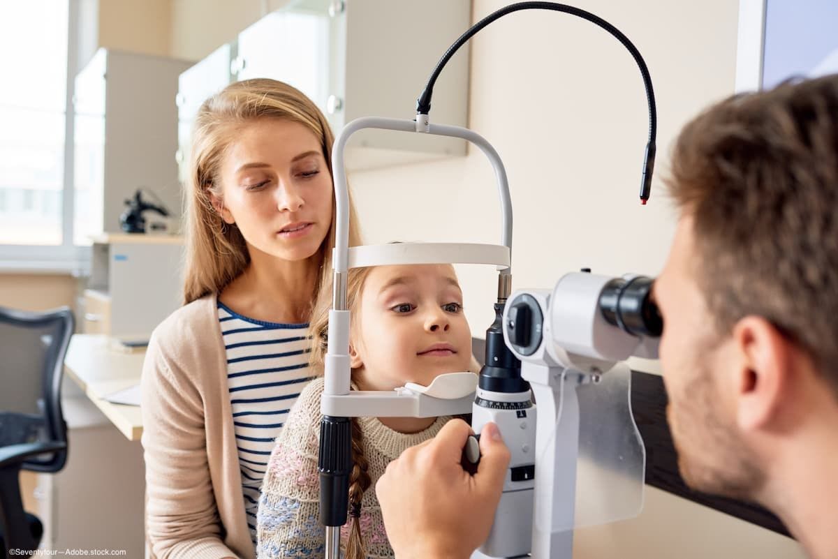 Woman with child getting an eye exam 