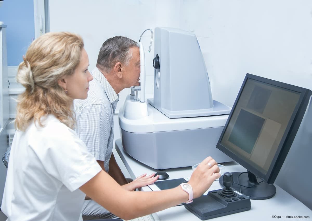 Woman optometrist at computer conducting retinal tomography for older male patient Image Credit: AdobeStock/Olga