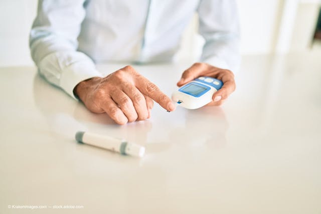 Close up of man with diabetes using insulin glucometer with blood from the finger (Adobe Stock / Krakenimages.com)