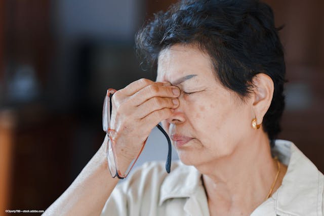 woman rubs eyes due to ocular itching associated with allergic conjunctivitis - Image credit: Adobe Stock / Oporty786