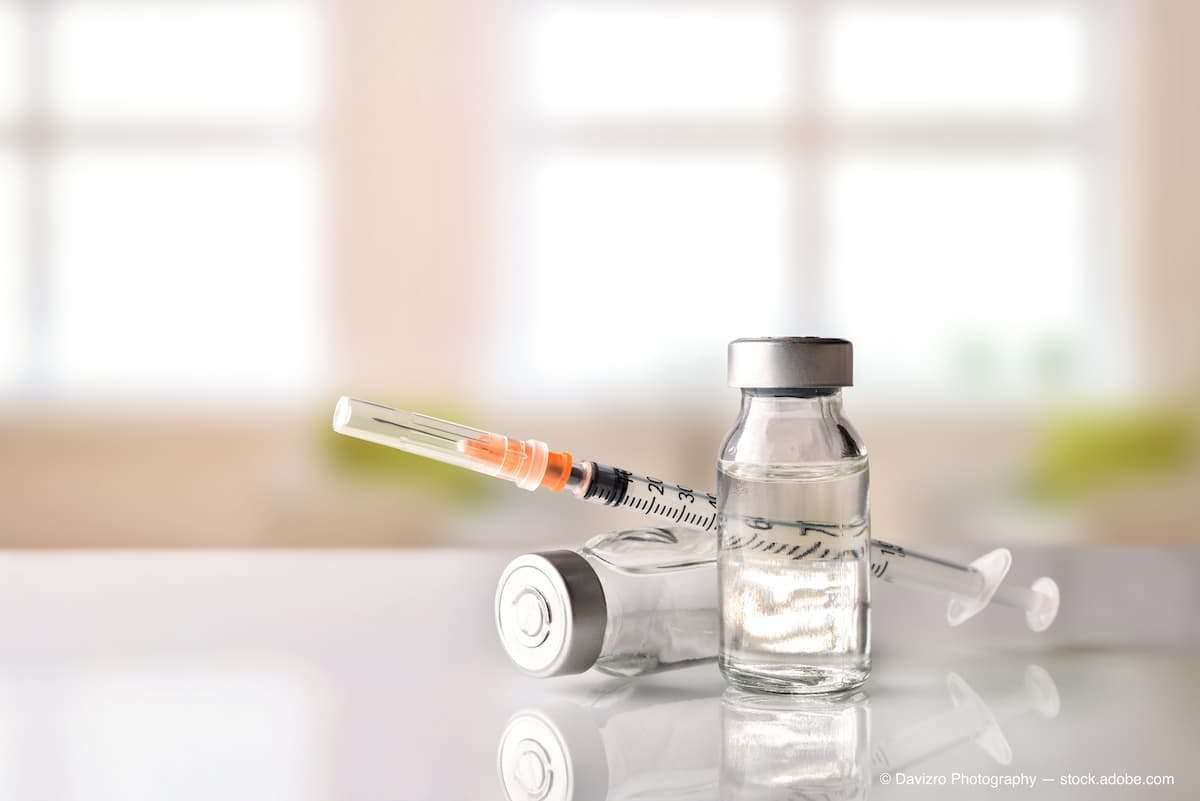 Vials and syringe on white table with background windows (Adobe Stock / Davizro Photography)