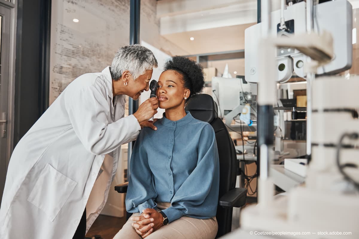 Doctor, vision or black woman in eye exam consultation or assessment for eyesight at optometrist office. Mature or senior optician helping a customer testing or checking iris or retina visual health  (Adobe Stock / Coetzee/peopleimages.com)