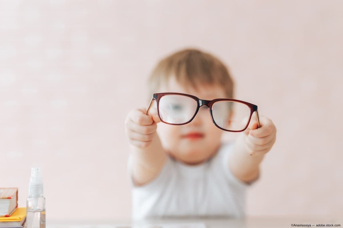 Child in background holding glasses with outstretched arms Image Credit: AdobeStock/Anastassiya