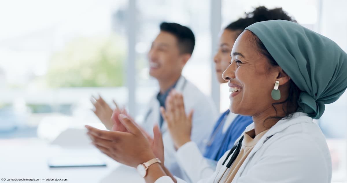 Group of physicians smiling Image Credit: AdobeStock/DLahoud/peopleimages.com